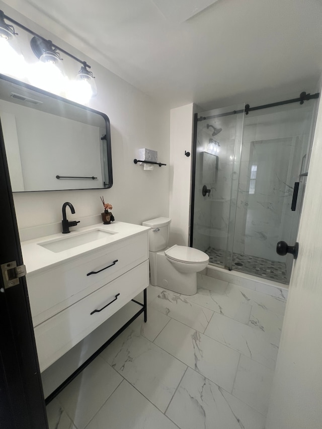 full bath with vanity, a shower stall, toilet, and marble finish floor