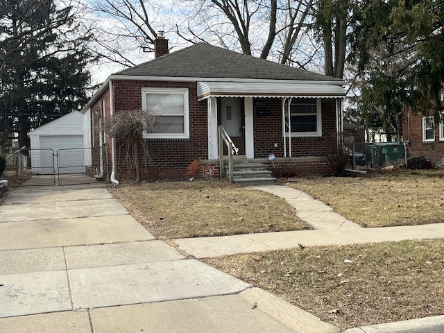 bungalow-style home featuring brick siding, fence, a porch, a chimney, and a gate