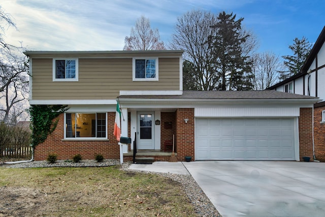 traditional-style home with brick siding, concrete driveway, an attached garage, and fence