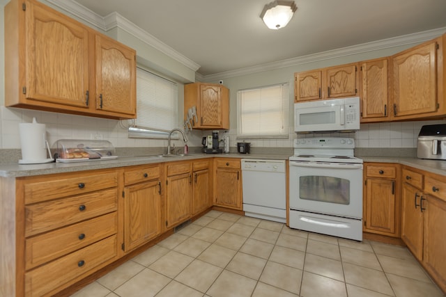 kitchen featuring a sink, tasteful backsplash, white appliances, crown molding, and light tile patterned floors