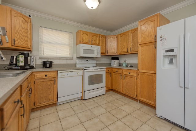 kitchen featuring white appliances, a sink, light countertops, crown molding, and tasteful backsplash