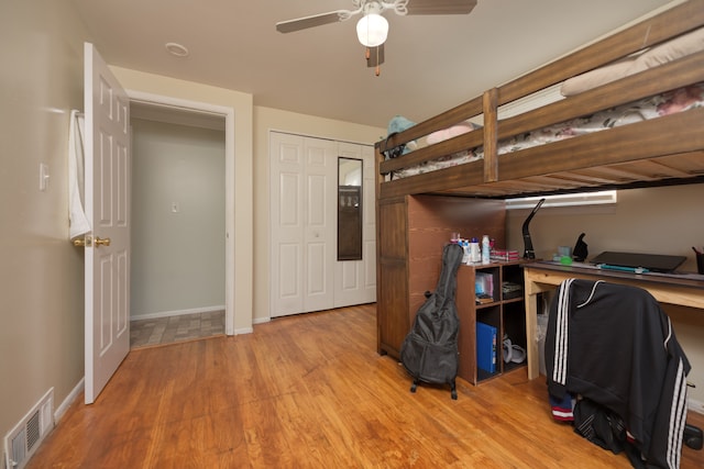 bedroom featuring baseboards, visible vents, and light wood-type flooring