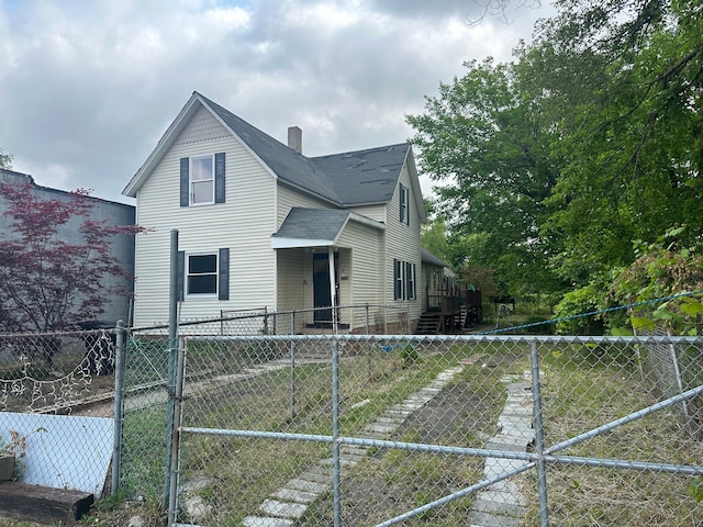 1728 Bellevue St, Detroit, MI 48207 - exterior space with a shingled roof, fence, and a chimney