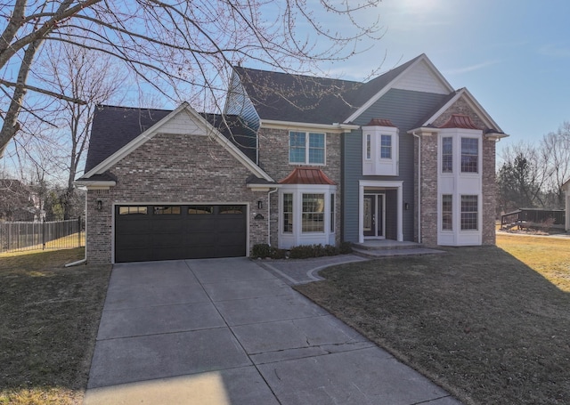 view of front of home with brick siding, fence, a front yard, a garage, and driveway