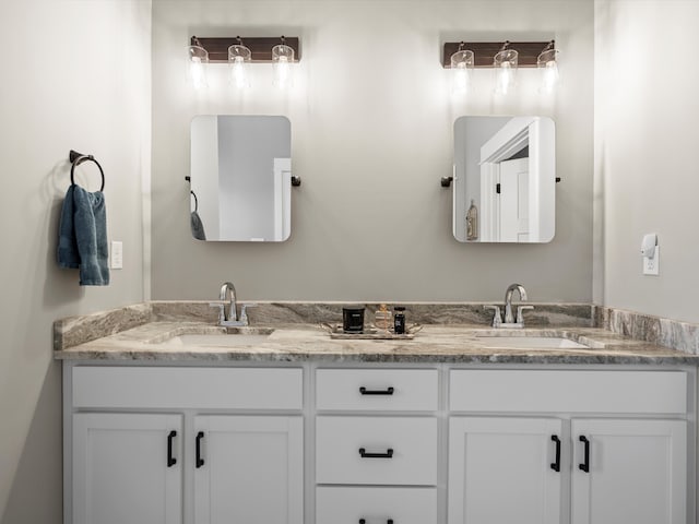 full bath with double vanity and a sink