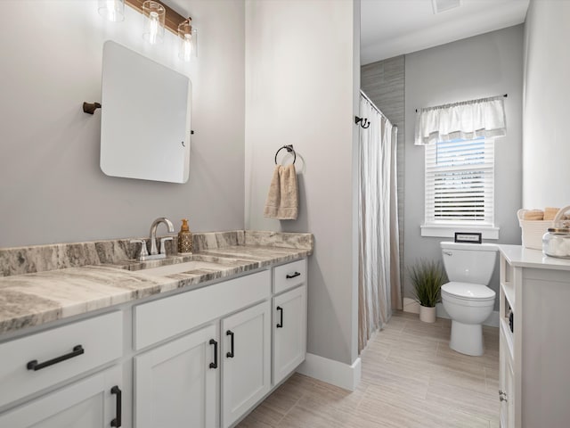 bathroom with visible vents, toilet, vanity, and a shower with curtain