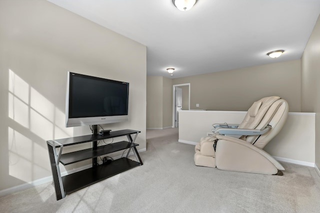 living area with baseboards and carpet flooring