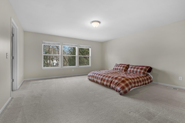 bedroom featuring carpet, baseboards, and visible vents