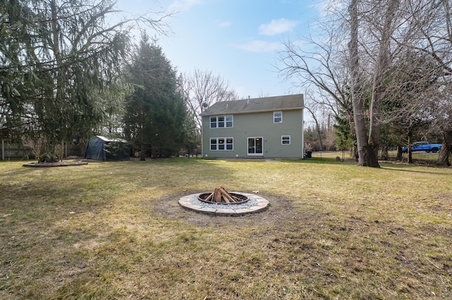 view of yard featuring a fire pit and fence