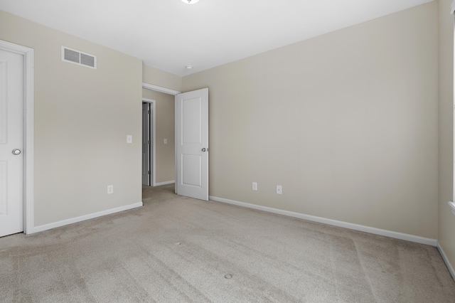 unfurnished bedroom featuring visible vents, baseboards, and carpet floors