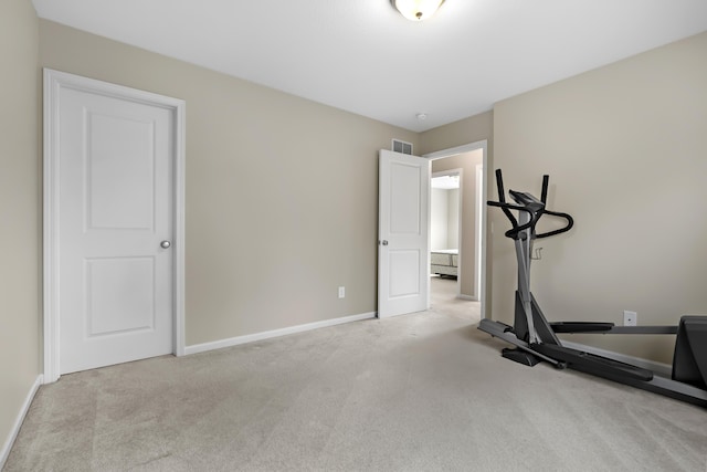 exercise room with carpet flooring, baseboards, and visible vents