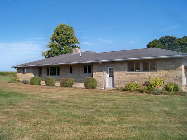 single story home featuring a chimney, a front lawn, and a shingled roof