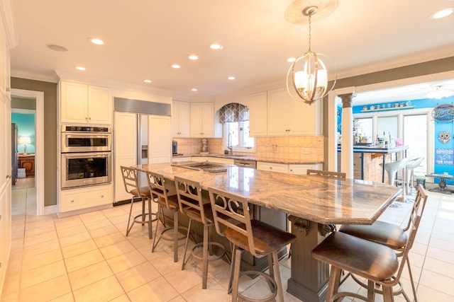 dining room featuring light tile patterned floors, recessed lighting, and ornamental molding