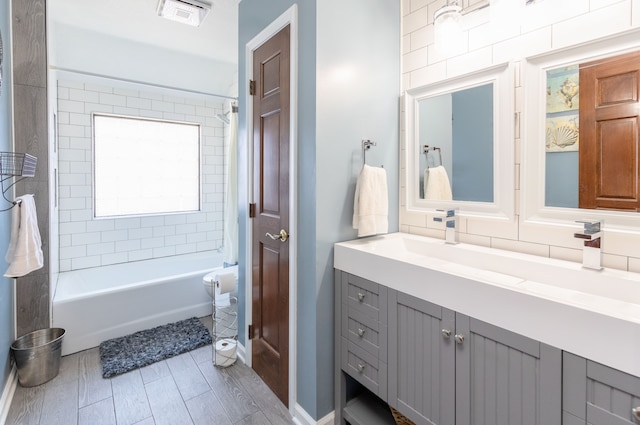 full bathroom with vanity, visible vents, and shower / bathtub combination