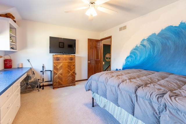 bedroom featuring visible vents, lofted ceiling, light colored carpet, and a ceiling fan