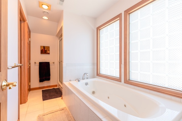 full bathroom with visible vents, a jetted tub, a stall shower, and tile patterned flooring