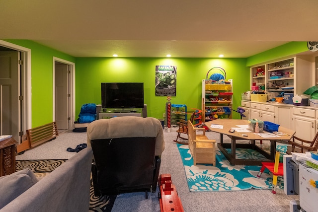 rec room with recessed lighting and light colored carpet