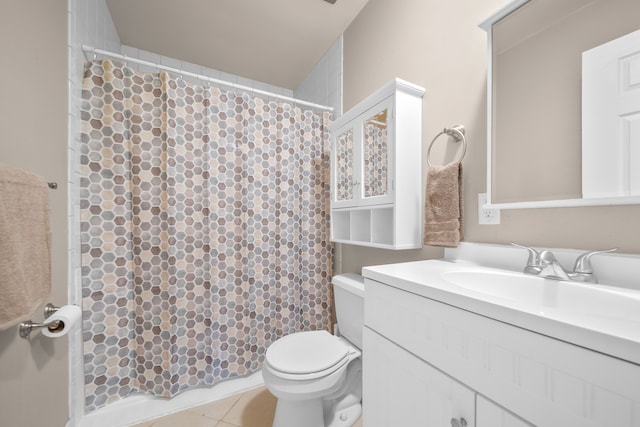 bathroom with tile patterned floors, a shower with curtain, toilet, and vanity