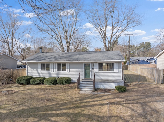 single story home featuring a front lawn and fence