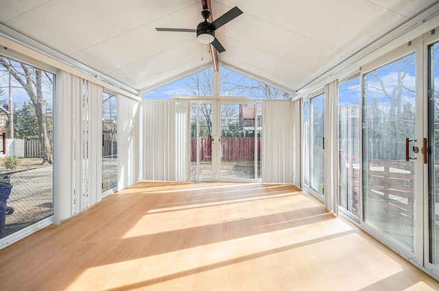 unfurnished sunroom with lofted ceiling and ceiling fan