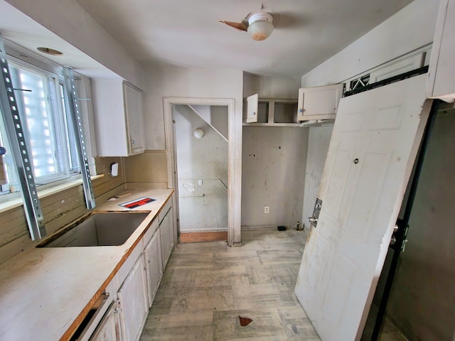 20048 Fleming St, Detroit, MI 48234 - kitchen with white cabinetry, light countertops, a sink, and open shelves