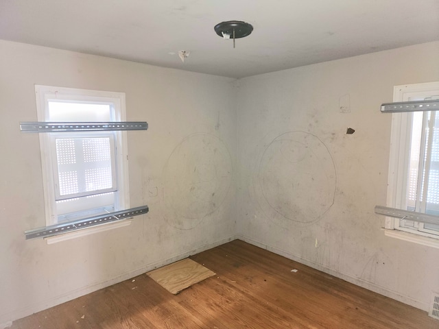 20048 Fleming St, Detroit, MI 48234 - unfurnished room featuring plenty of natural light, visible vents, and wood finished floors