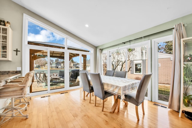 dining room featuring recessed lighting, visible vents, and light wood finished floors