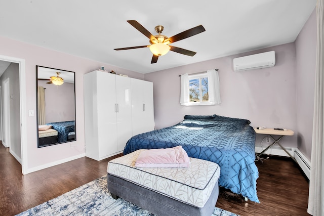 bedroom featuring an AC wall unit, a baseboard heating unit, dark wood-style floors, baseboards, and ceiling fan