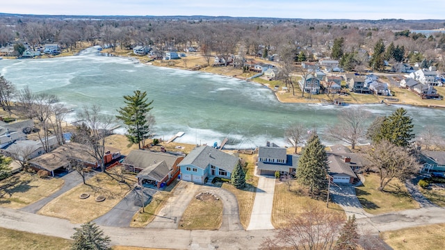 aerial view with a residential view and a water view