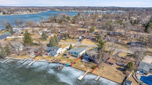 birds eye view of property featuring a residential view and a water view