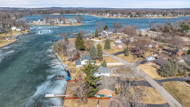 bird's eye view featuring a residential view and a water view