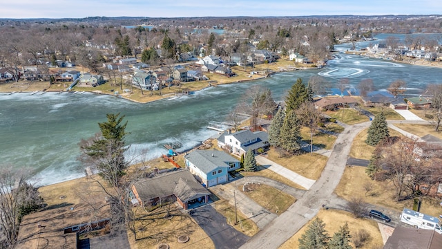 birds eye view of property featuring a residential view and a water view