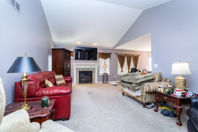 living area with visible vents, high vaulted ceiling, carpet floors, a fireplace, and baseboards