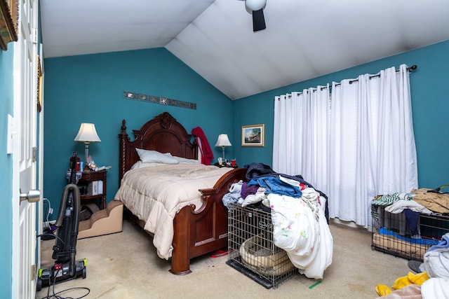 bedroom with carpet flooring, lofted ceiling, and a ceiling fan