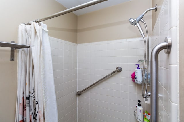 full bathroom with a tile shower