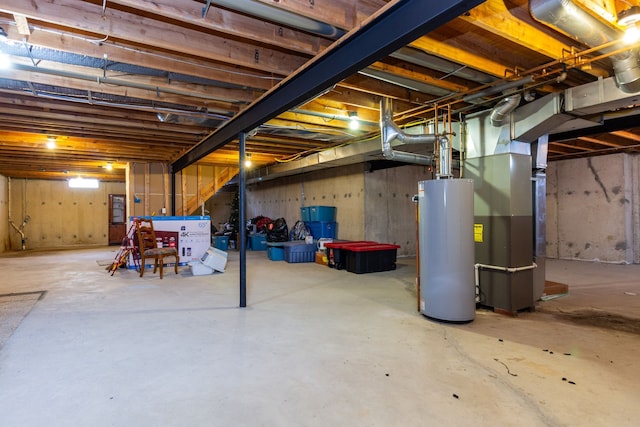 unfinished basement with heating unit and water heater