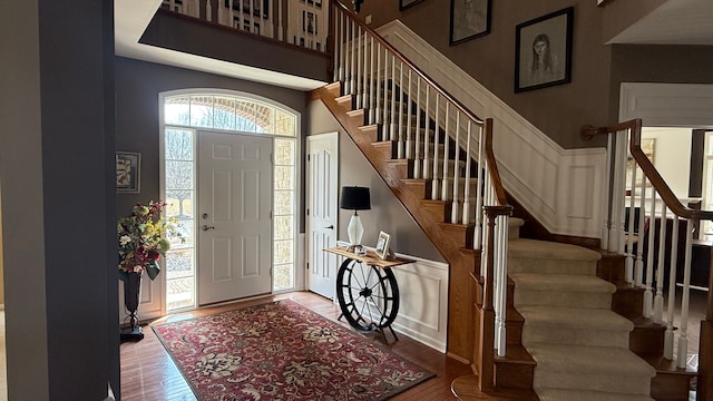 entryway featuring a high ceiling and wood finished floors