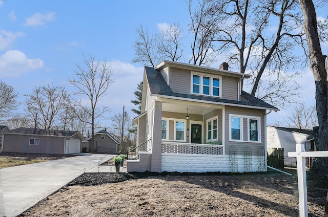 bungalow-style home featuring a porch, fence, roof with shingles, an outdoor structure, and a chimney