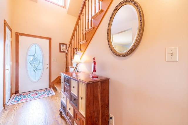 entrance foyer with stairway and wood finished floors