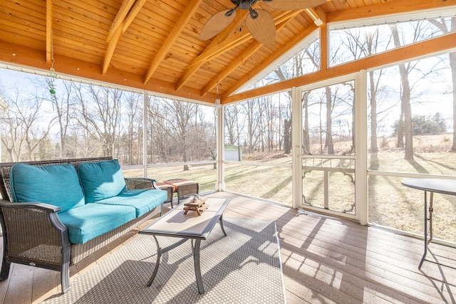 sunroom / solarium featuring lofted ceiling with beams, wooden ceiling, and ceiling fan