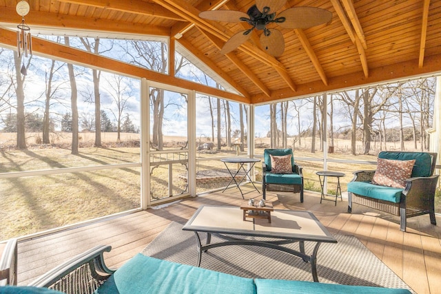 sunroom / solarium featuring vaulted ceiling with beams, wood ceiling, and ceiling fan