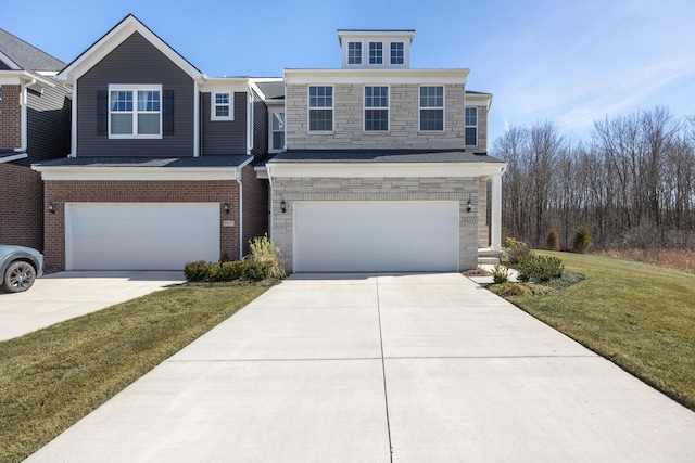 view of front of house featuring stone siding, concrete driveway, a garage, and a front yard