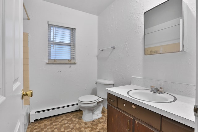 full bath featuring vanity, a bathing tub, tile patterned floors, toilet, and baseboard heating