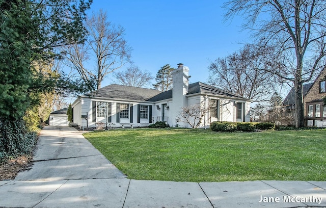 view of front of property featuring a front yard and a chimney