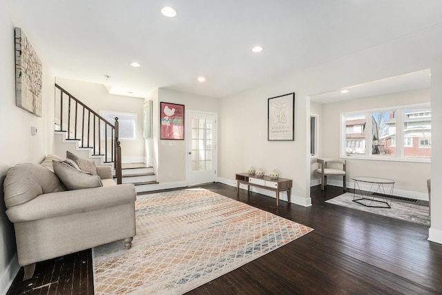 living area featuring stairs, recessed lighting, wood finished floors, and baseboards