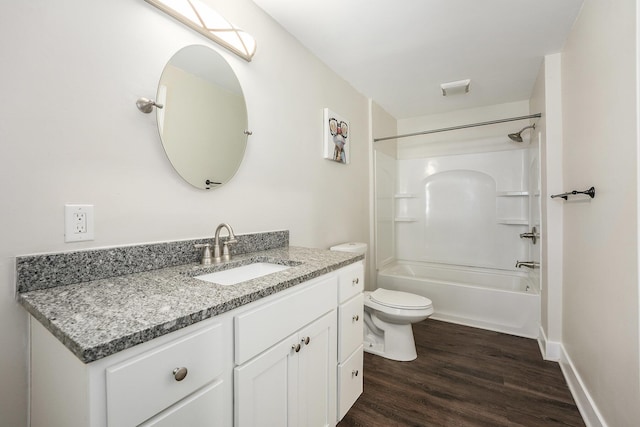 full bathroom featuring tub / shower combination, baseboards, toilet, wood finished floors, and vanity