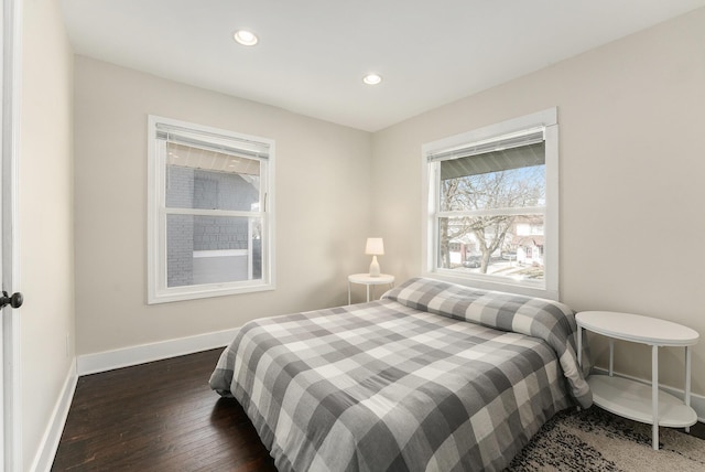 bedroom featuring recessed lighting, baseboards, and dark wood-style flooring