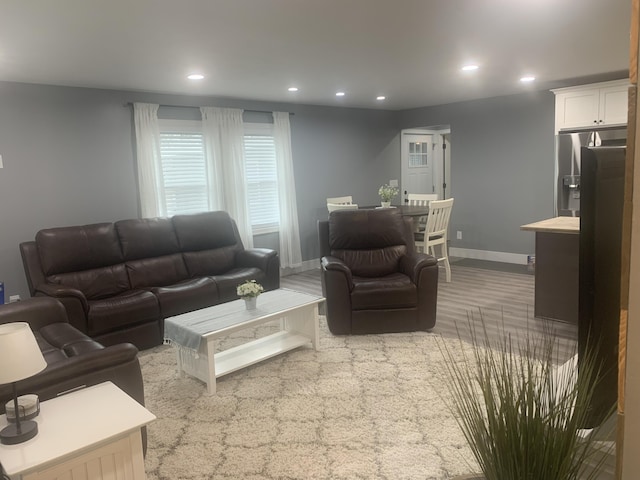 living room featuring recessed lighting and baseboards