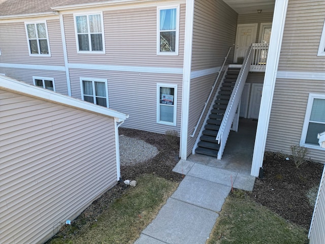 view of side of home with stairs