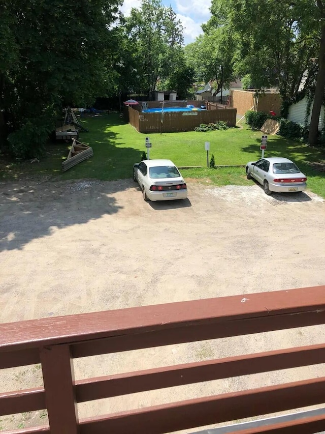 view of yard with a fenced in pool